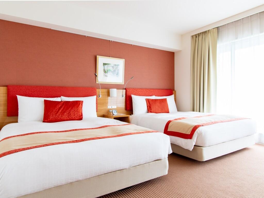 本館デラックス室｜ベッド